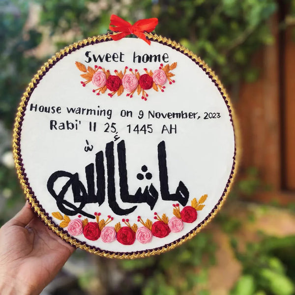 Handmade Hoop Embroidery Art titled "Sweet Home: House Warming Hoop Art" featuring a warm message, housewarming date, and intricate floral embroidery, displayed in a hoop.