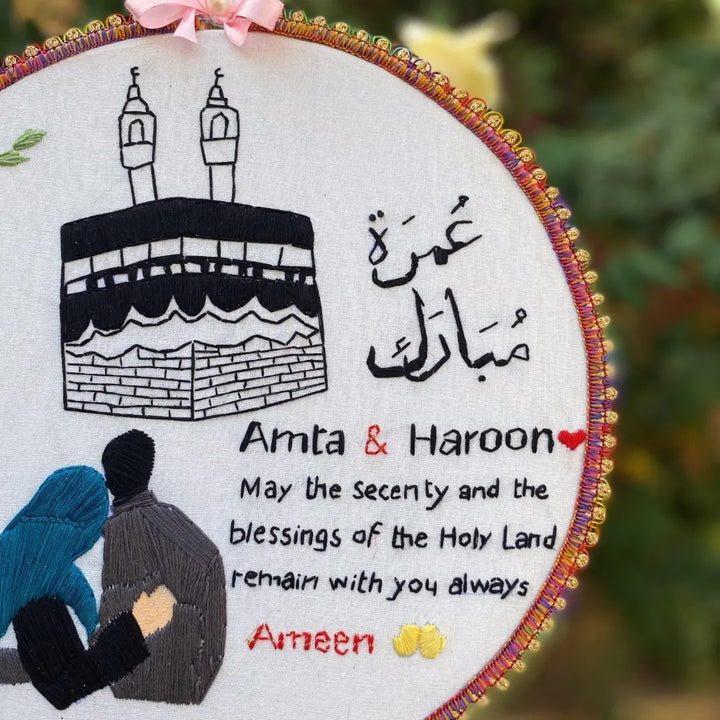 Handmade Hoop Embroidery Art titled "Blessings of the Holy Land: Islamic Hoop Art" featuring a heartfelt message and intricate Islamic-inspired designs, displayed in a hoop.