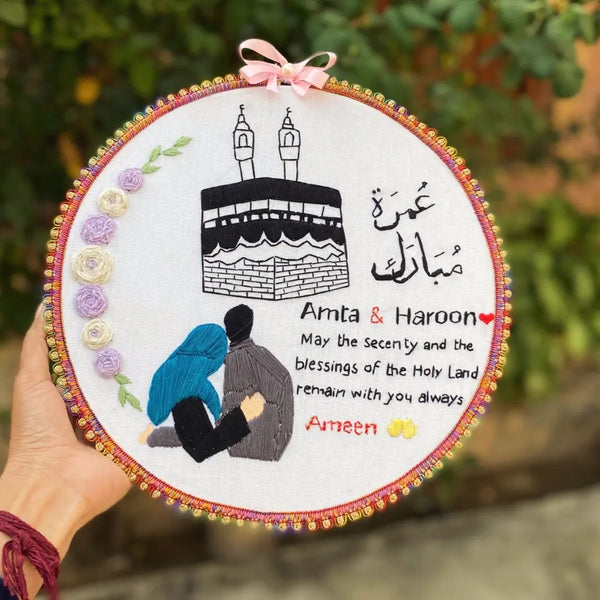 Handmade Hoop Embroidery Art titled "Blessings of the Holy Land: Islamic Hoop Art" featuring a heartfelt message and intricate Islamic-inspired designs, displayed in a hoop.