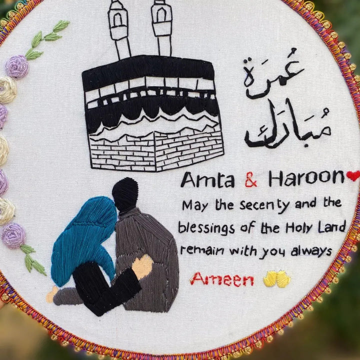 Handmade Hoop Embroidery Art titled "Blessings of the Holy Land: Islamic Hoop Art" featuring a heartfelt message and intricate Islamic-inspired designs, displayed in a hoop.