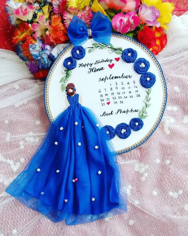 Handmade Hoop Embroidery Art titled "Happy Birthday Mina: A Celebration of Best Moments" featuring heartfelt messages and intricate floral embroidery, displayed in a hoop.
