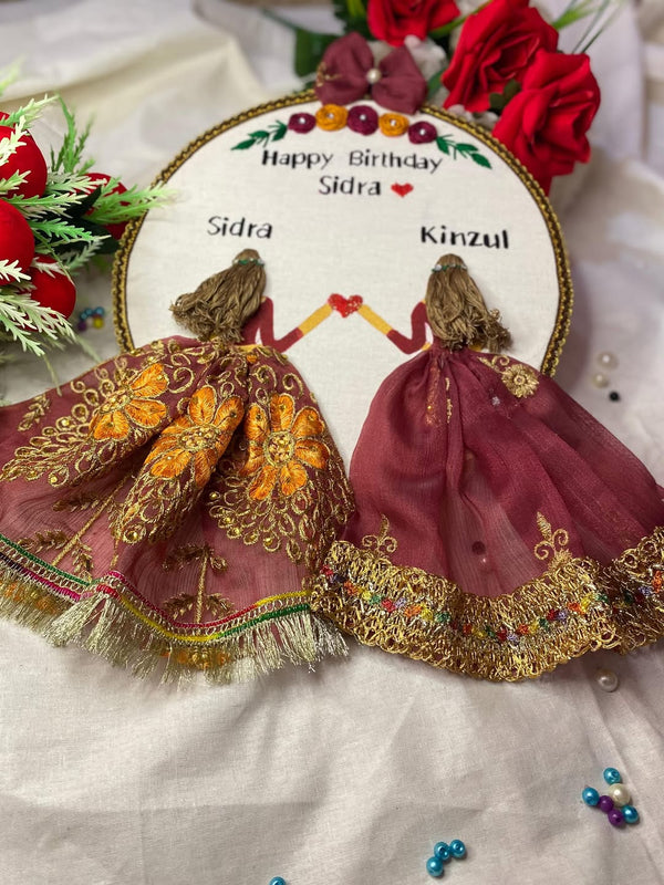 Handmade Hoop Embroidery Art titled "Happy Birthday Sidra" featuring a heartfelt birthday message with intricate embroidery designs, displayed in a standard embroidery hoop.