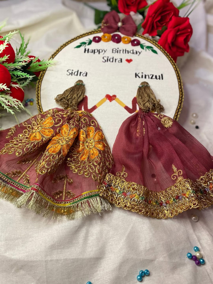 Handmade Hoop Embroidery Art titled "Happy Birthday Sidra" featuring a heartfelt birthday message with intricate embroidery designs, displayed in a standard embroidery hoop.