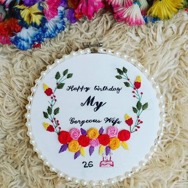 Handmade Hoop Embroidery Art titled "Sherry’s Birthday: A Tribute to a Gorgeous Wife" featuring heartfelt messages and elegant floral embroidery, displayed in a hoop.